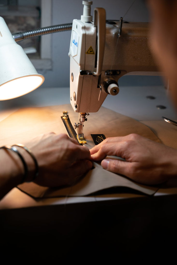 SMITH + PARKA FOUNDER DAVID LEE HAND SEWING A SOLO SLING IN BROOKLYN NEW YORK